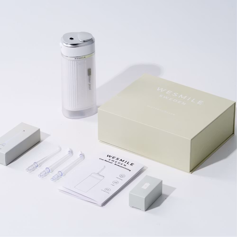 The Waterflosser Pro with its nozzles and case